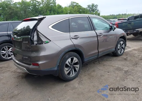 2015 Honda Cr-V Touring z USA, uszkodzony, nr VIN 5J6RM4H9XFL061928